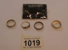 4 assorted 9ct gold rings including eternity and a pair of 9ct gold earrings featuring love heart