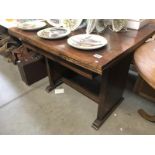 An oak drawer leaf table