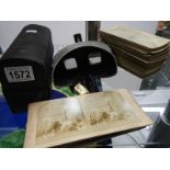 A stereoscope and stereo cards.