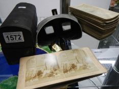 A stereoscope and stereo cards.