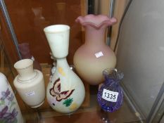 A mixed lot of coloured glass vases and a scent bottle.