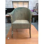 A Lloyd loom wing arm chair