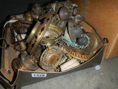 A box of old oil lamp parts including burners.