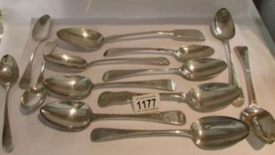 13 large silver spoons, approximately 700 grams.