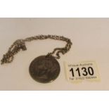 An 1847 Young Head Victorian silver crown on silver chain, approximately 39 grams.