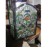 A Tiffany style glass fire screen