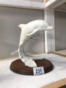A Kaiser porcelain dolphin group on base