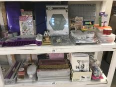 A good lot of craft work items on 2 shelves