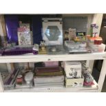 A good lot of craft work items on 2 shelves