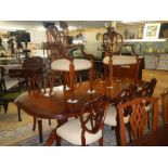 An extending mahogany table & 8 chairs