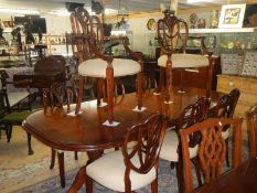 An extending mahogany table & 8 chairs