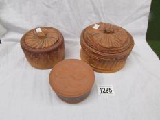 Three small round pie dishes with covers.