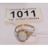 A 9ct gold ring set opal, size O.