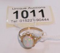 A 9ct gold ring set opal, size O.