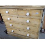 A pine 2 over 2 chest of drawers.