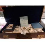 A case of Masonic items including jewels, books etc.