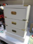 A lovely 3 drawer bedside cabinet in white with brass fittings