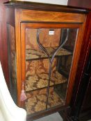 An Edwardian mahogany inlaid astragal glazed display cabinet.