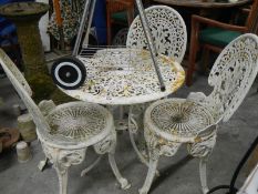 3 cast iron chairs and cast iron table