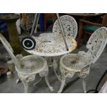 3 cast iron chairs and cast iron table