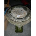 2 stone bird baths and stone lion