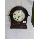 A mahogany inlaid bracket clock.