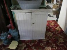 A painted pine cupboard