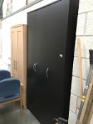 A black ash finished triple wardrobe