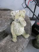 A stone teddy bear
