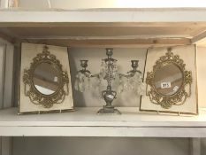 A pair of ormalu gilded wall mirrors and a 3 arm candelabra with glass droppers