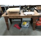 An industrial oak top work table