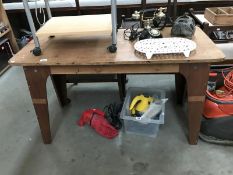 An industrial oak top work table