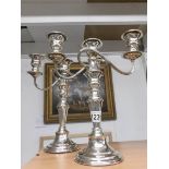 A pair of silver plate candelabra.