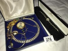 A quantity of costume jewellery including ladies watches, brooches, pendants, rolled gold etc.