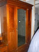 An Edwardian mahogany wardrobe