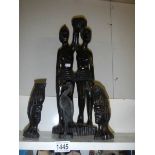 4 carved African figures.