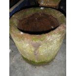 A circular stone planter