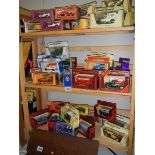 Approximately 40 boxed die cast models (3 shelves).