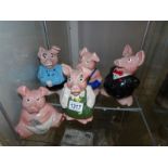 A set of 5 Wade Nat West pig money boxes.