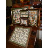 7 framed and glazed sets of regimental cigarette cards.