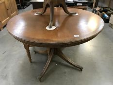 S dark wood stained round dining table on brass lions paws castors