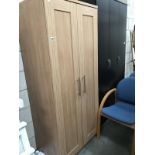 A light oak effect double wardrobe