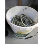 A bucket of 10 pairs of old stirrup irons