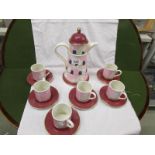 A Carlton ware coffee set comprising coffee pot with 6 cups and saucers featuring doves and