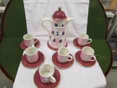 A Carlton ware coffee set comprising coffee pot with 6 cups and saucers featuring doves and