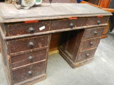 An old pine kneehole desk