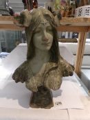 A French art nouveau bust of a lady, signed.