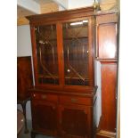 A mahogany glazed top book case.