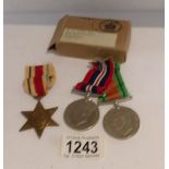 3 WW2 medals consisting of War Medal, Defence Medal and Africa Star with dispatch box for B. G.
