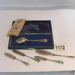 A cased silver 'Liberty' spoon and 4 silver butter knives, approximately 40 grams.